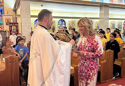 The principal of the Assumption of the Blessed Virgin Mary School was received into the Catholic Church.
